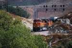 BNSF 7912 and the rest of her vehicle train come into full view as she heads south/west.